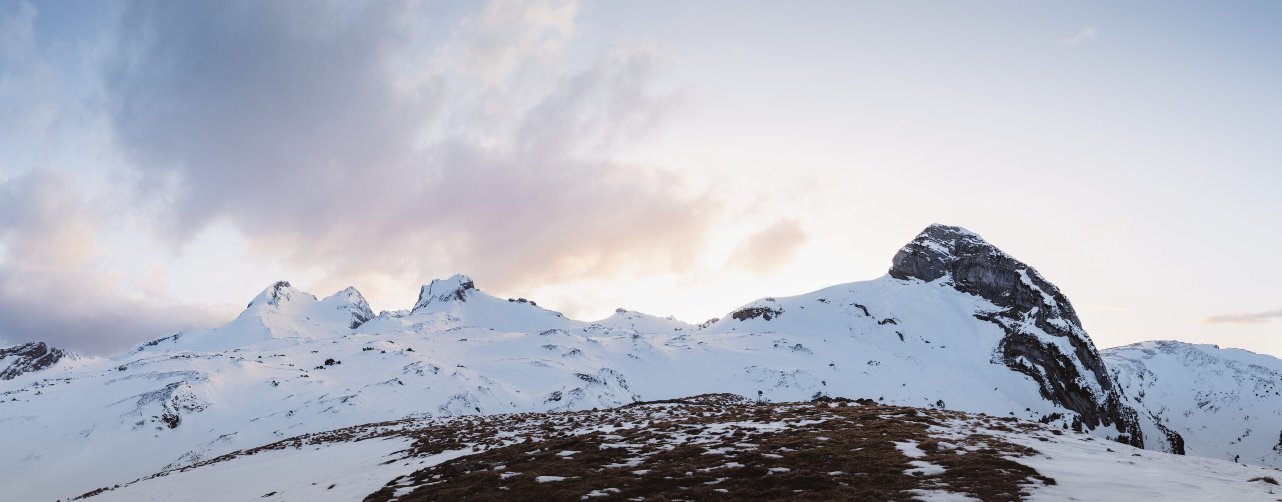 Panorama of the Margelchopf and Aliver hiking trails during sunset in winter